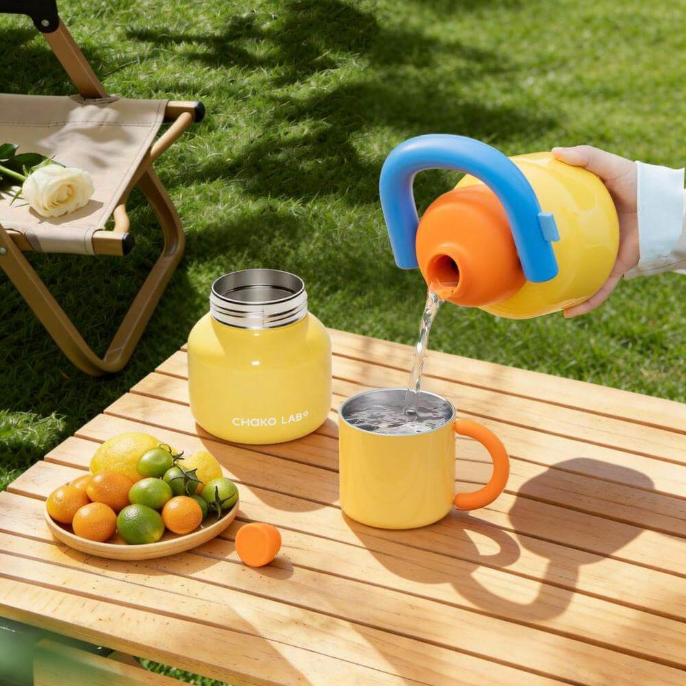 Yellow LinLin Kettle water bottle by Chakolab, featuring a sleek design and vibrant color, shown in a lifestyle setting.
